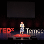 Diane Strand speaking at a creative arts event, empowering students and entrepreneurs through JDS Creative Academy and DigiFest® Temecula in California.