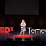 Diane Strand speaking at a creative arts event, empowering students and entrepreneurs through JDS Creative Academy and DigiFest® Temecula in California.