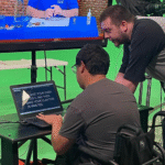 Students collaborating on a digital media project at JDS Creative Academy, learning video production and creative storytelling