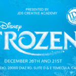 Frozen Jr. cast performing on stage at the JDS Creative Academy Winter Showcase with students in colorful costumes expressing emotion and teamwork